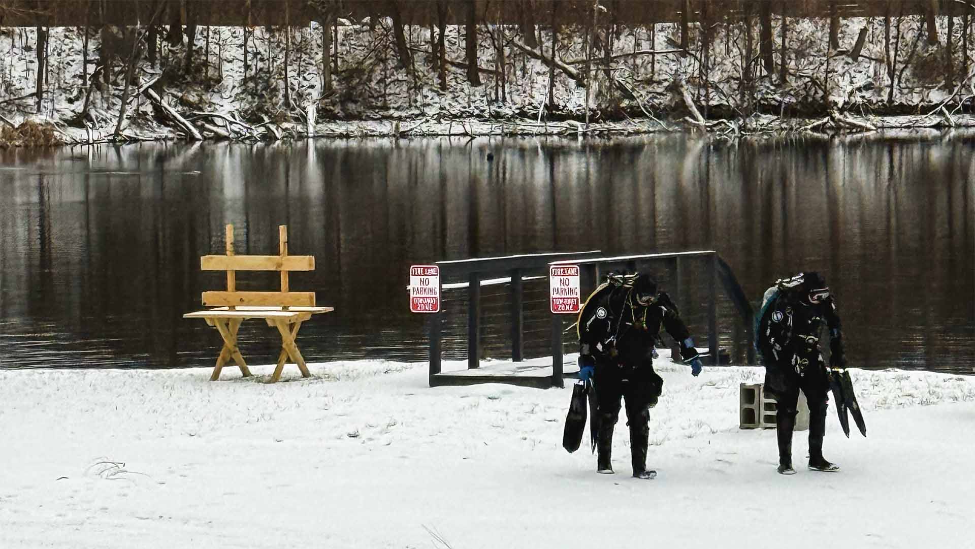 Winter scuba divers after returning from diving in Ohio at Gilboa Quarry snow covered dive site